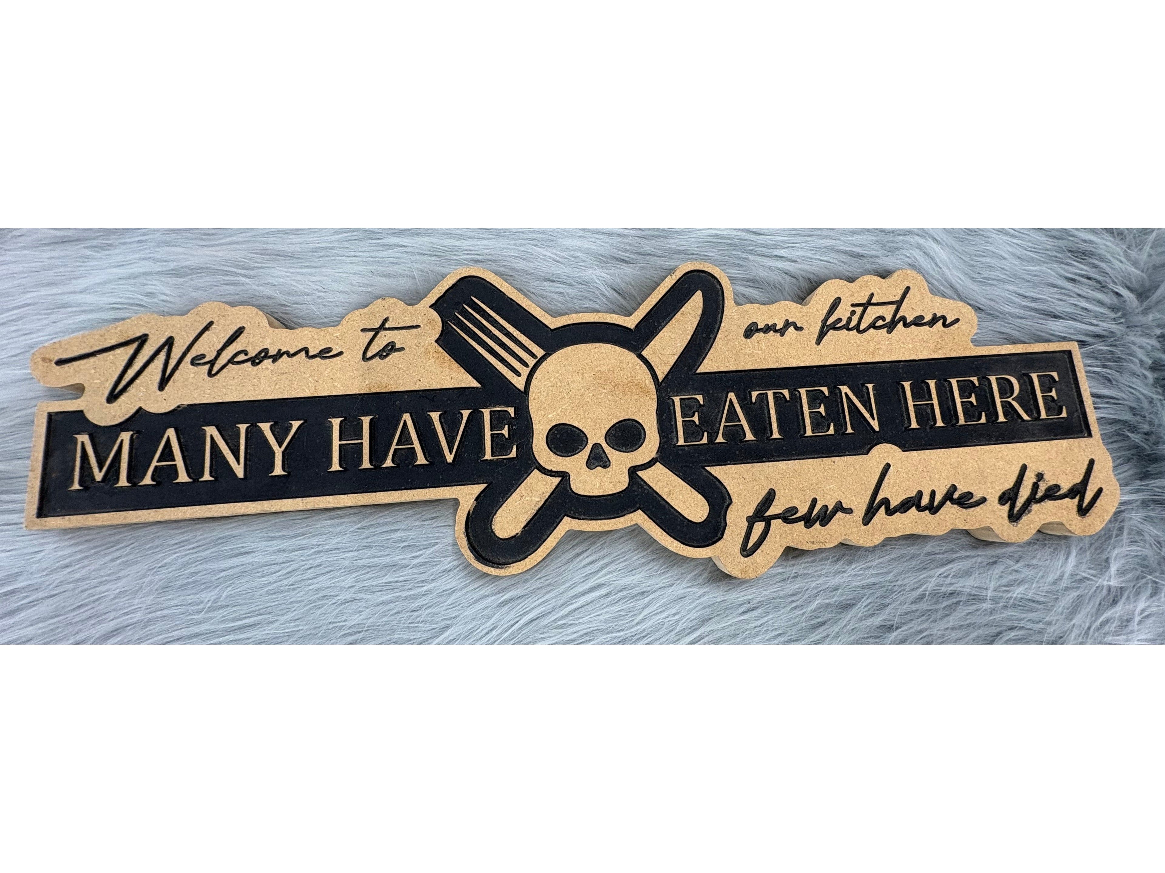 Funny Kitchen Sign | “Welcome to Our Kitchen – Many Have Eaten Here, Few Have Died” | CNC Engraved Wall Decor